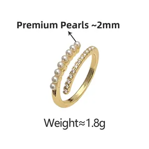 Detail view of double-layer open ring with white pearls and sparkling cubic zirconia