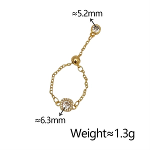 Detail of adjustable gold chain ring with square zirconia and sliding ball sizing link