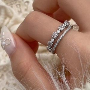 Macro detail of silver double-layered stackable rings with micro-pave cubic zirconia