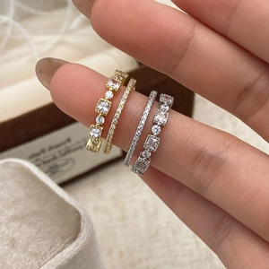 Stackable set of four sparkling zircon open rings in gold and silver minimalist finishes