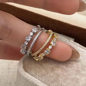 Sparkling zircon open rings set in gold and silver finish with pave-set square crystals