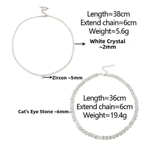 Détail de colliers en cristal blanc et pierre d'oeil de chat avec pendentif zircon