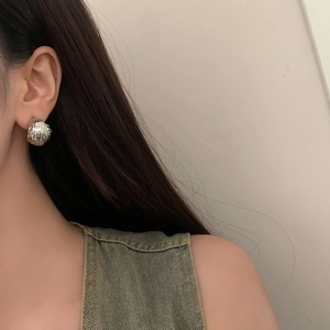 French style C-shaped textured silver metal stud earrings with hammered dome design