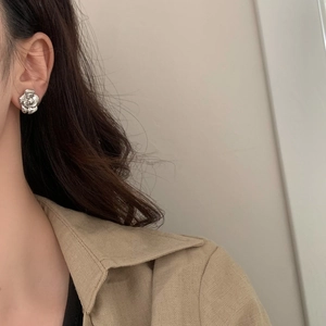 Elegant silver 3D rose petal stud earrings shown on model for a sophisticated look