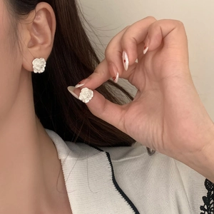 Elegant white camellia stud earrings for women featuring detailed floral resin design