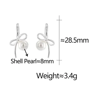 Silver bow stud earrings with 8mm shell pearl pendants measuring 28.5mm in height