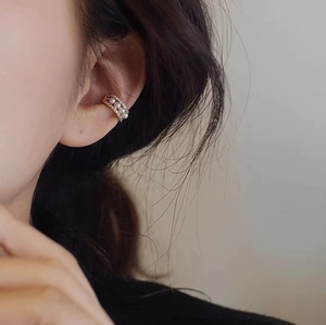 Elegant gold multi-layer ear cuff with white pearls and sparkling zircon accents