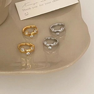 Minimalist huggie hoop earrings with sparkling zircon dangles in gold and silver finish