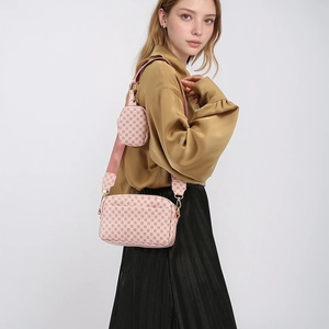 Pink monogram crossbody bag with matching round coin purse on wide fabric strap