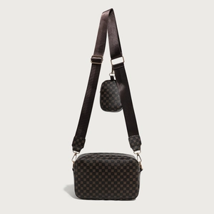 Detail of vintage patterned two-in-one crossbody bag with matching round coin purse