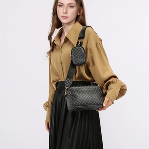 Close-up of stylish grey printed crossbody bag with detachable round coin purse and strap