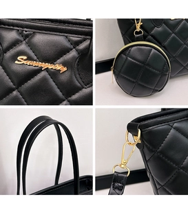 Dettaglio borsa shopper trapuntata nera con logo dorato, mini pochette e cuciture di pregio