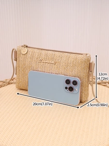 Detailed view of beige straw long wallet with gold zipper and dimension labels