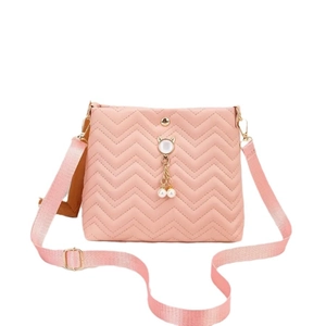 Pink wave quilted crossbody bag for women featuring a cute cat pearl pendant accent