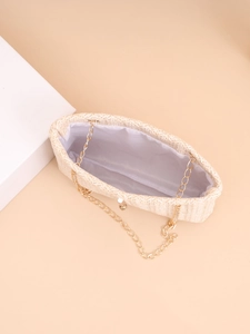 Detail of beige woven chain bag showing spacious interior with white fabric lining