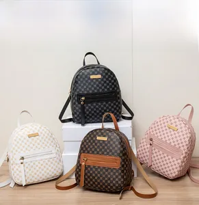 Detailed display of four mini PU leather backpacks with dot pattern and gold metal plates