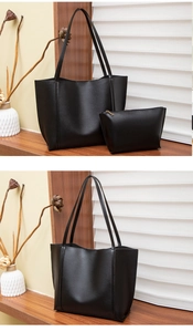 Vue détaillée d'un ensemble de sacs fourre-tout noirs en similicuir avec texture et zip doré