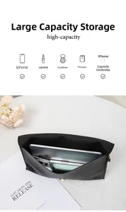 Interior view showing high capacity of the black leather clutch bag with daily essentials