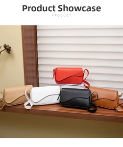 Detailed view of five colorful crossbody bags with asymmetric flap on wooden shelves