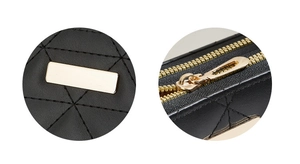 Close-up of quilted black leather texture and premium gold metal zipper hardware detail