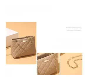Detail view of khaki quilted shoulder bag with golden chain strap and textured leather