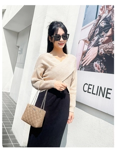 Chic beige quilted chain shoulder bag paired with a minimalist urban knit outfit