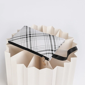 Minimalist plaid print white leather clutch bag with black zipper and gold pendant