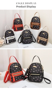 Detail view of mini backpacks in five colors with floral bow prints and gold hardware