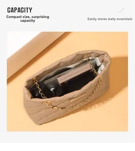 Internal storage detail of beige quilted chain bag showing capacity for phone and makeup