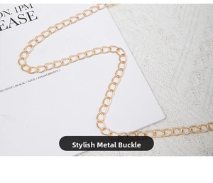 Close-up of polished light gold metal chain strap for stylish envelope clutch bag