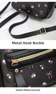 Detail of gold metal zipper and adjustment buckle on black mini leather floral backpack