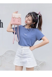 Detail of pink and white PU leather mini backpack with double buckle and adjustable straps