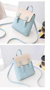 Detailed dual-angle view of two-tone light blue and beige small backpack with buckles