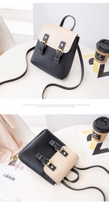 Macro detail of high-quality polished gold buckles on a black and white mini backpack