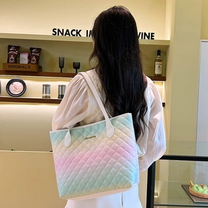 Quilted pastel gradient tote bag with rhombic stitching and slim white shoulder straps