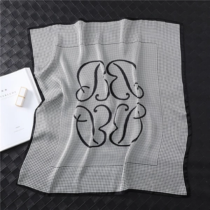 Classic black and white houndstooth silk square scarf with artistic central logo pattern