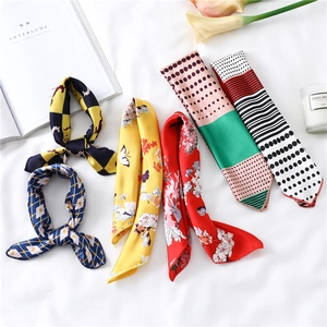 Elegant 50cm square silk scarves with floral and geometric patterns on white fabric