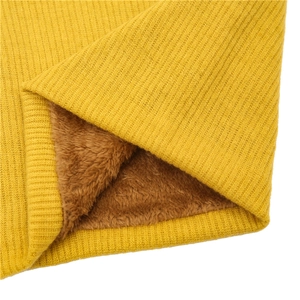 Detail view of yellow ribbed knit fabric with soft brown plush lining for warmth