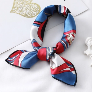 Detail of silk square scarf showing geometric pattern and fine overlock edge stitching