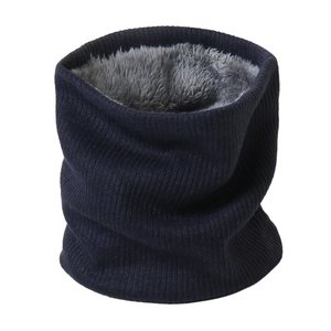 Macro detail of navy knit neck warmer with thick grey faux fleece lining for winter warmth