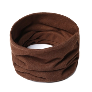 Detailed view of dark brown knitted neck warmer with thick ribbed texture and elastic design