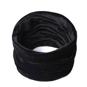 Detailed view of the thick black velvet neck warmer with a soft winter texture