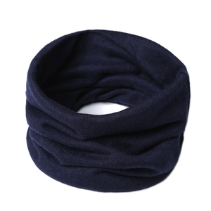 Detailed knit texture of a dark blue windproof thermal neck warmer in a soft cotton blend
