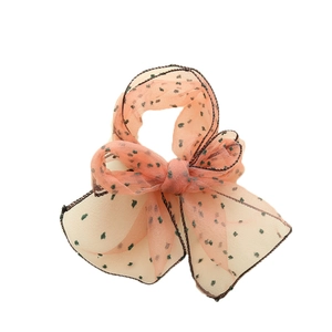 Nœud à cheveux en seersucker orange transparent avec pois verts et bordure noire
