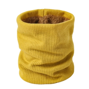 Detail of yellow knitted neck warmer showing thick brown fleece lining for winter warmth