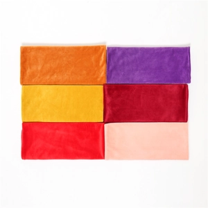 Close-up of velvet neck warmer scarves in six vibrant solid colors for autumn and winter