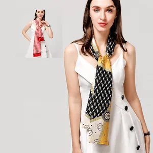 Detail of a narrow silk scarf with houndstooth and geometric prints in various styles