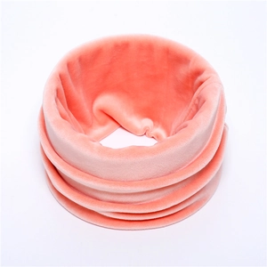 Detail of coral pink velvet neck warmer with soft plush texture and seamless loop design