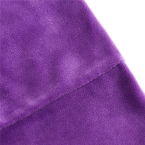 Macro texture of soft purple velvet fabric with elegant glossy finish on neck warmer