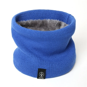 Detailed close-up of blue knitted neck warmer with thick gray fleece lining for winter